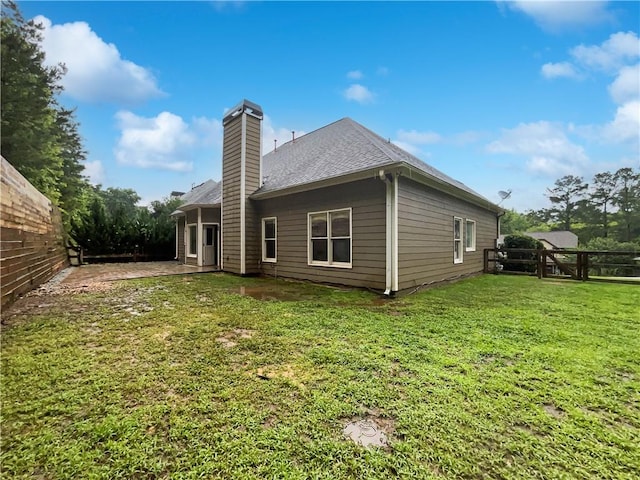 200 Pine Trl, Dallas, GA 30157 - back of house featuring a chimney, a patio, and a shingled roof