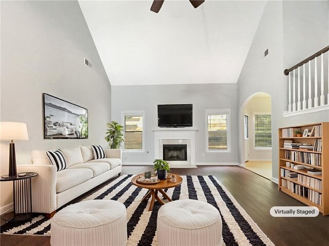 200 Pine Trl, Dallas, GA 30157 - living room featuring high vaulted ceiling, arched walkways, a ceiling fan, wood finished floors, and baseboards