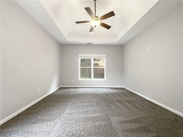 200 Pine Trl, Dallas, GA 30157 - carpeted empty room with a tray ceiling, a ceiling fan, and baseboards
