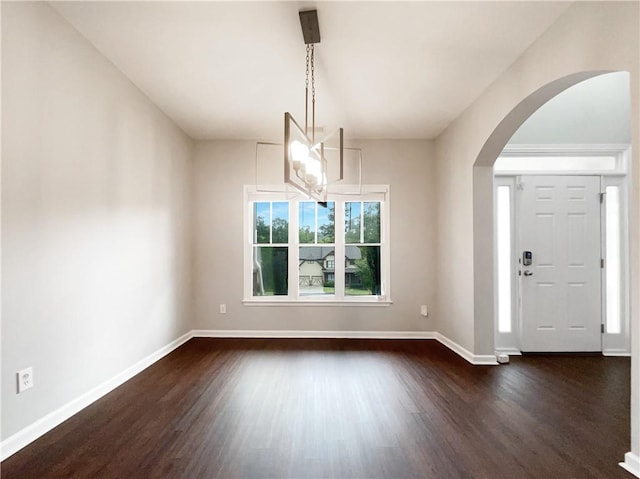 200 Pine Trl, Dallas, GA 30157 - entryway featuring dark wood-style flooring, arched walkways, baseboards, and a chandelier