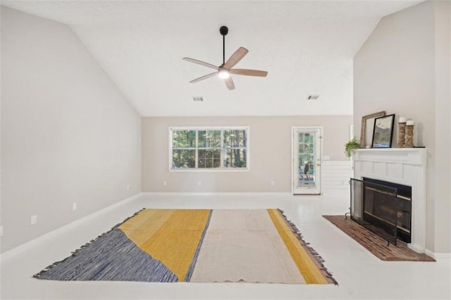 living room featuring ceiling fan and vaulted ceiling