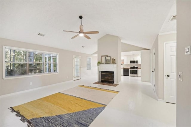 living room featuring ceiling fan and lofted ceiling