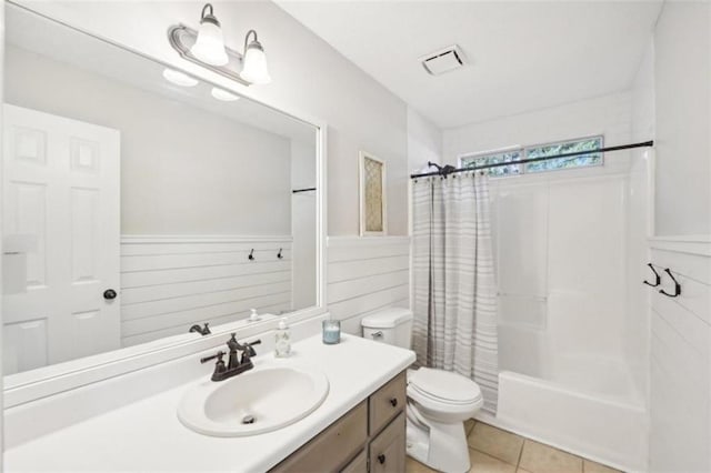 full bathroom with vanity, toilet, shower / bathtub combination with curtain, and tile patterned flooring