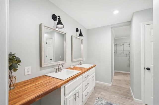 bathroom with hardwood / wood-style flooring and vanity