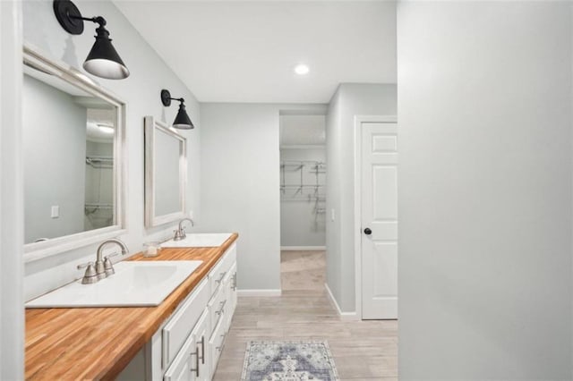 bathroom featuring hardwood / wood-style floors and vanity