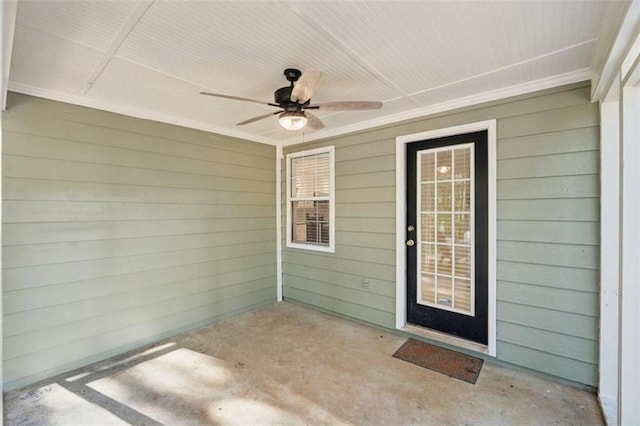 property entrance featuring a patio and ceiling fan