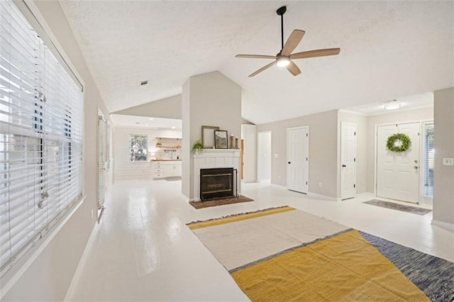 living room featuring vaulted ceiling and ceiling fan