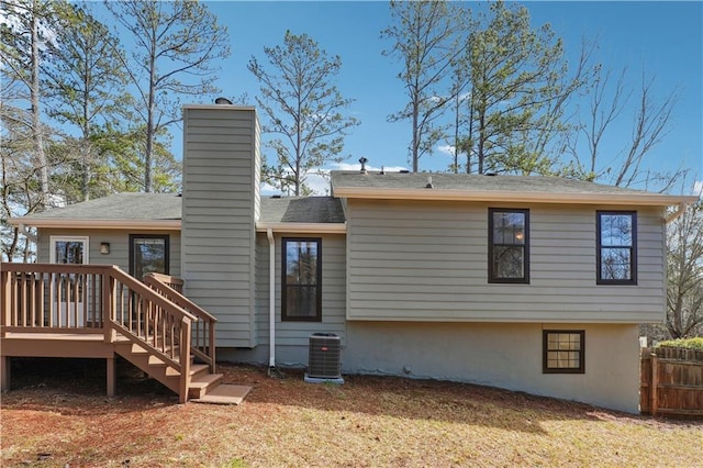 back of property featuring a wooden deck and central AC unit