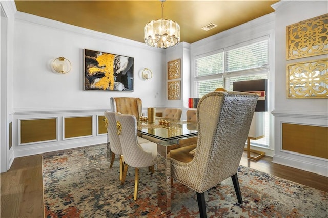1165 Laurel Pl SE, Smyrna, GA 30080 - dining area featuring a chandelier, wood finished floors, and ornamental molding