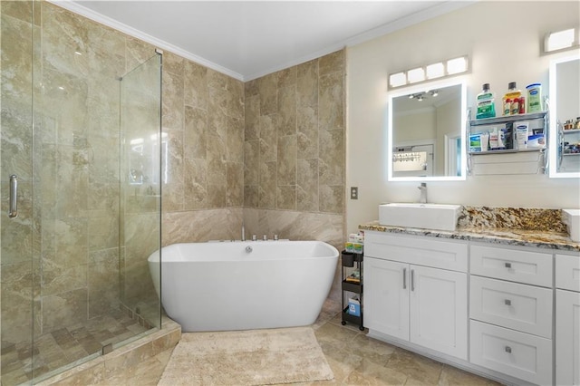 1165 Laurel Pl SE, Smyrna, GA 30080 - full bath featuring crown molding, tile walls, vanity, a freestanding bath, and a stall shower