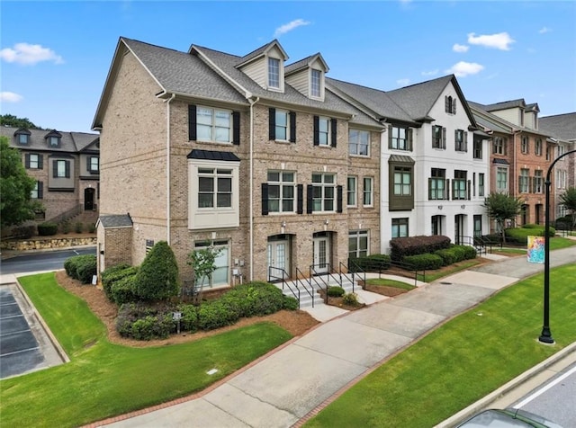 1165 Laurel Pl SE, Smyrna, GA 30080 - multi unit property with brick siding, a residential view, and a front yard