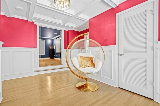 1165 Laurel Pl SE, Smyrna, GA 30080 - corridor featuring a decorative wall, coffered ceiling, crown molding, wood finished floors, and wainscoting