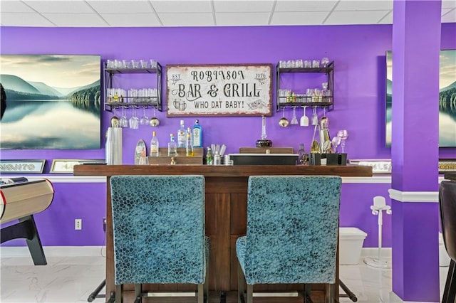 1165 Laurel Pl SE, Smyrna, GA 30080 - indoor wet bar with marble finish floors and baseboards