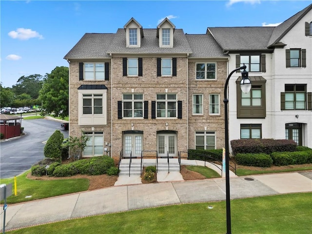 1165 Laurel Pl SE, Smyrna, GA 30080 - townhome / multi-family property featuring french doors and brick siding