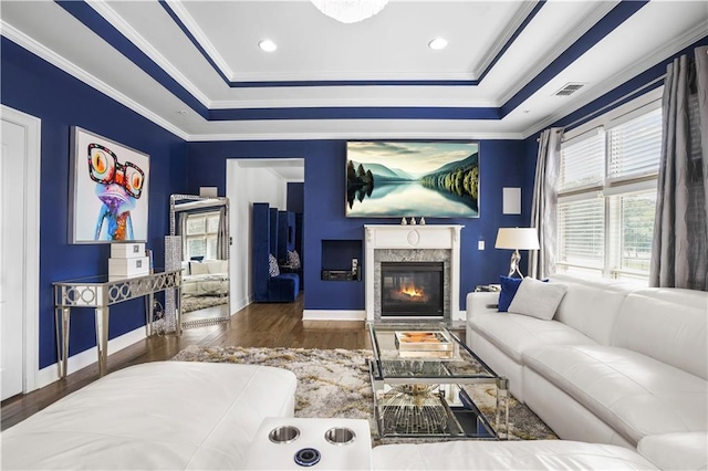 1165 Laurel Pl SE, Smyrna, GA 30080 - living area with wood finished floors, a tray ceiling, a fireplace, and crown molding