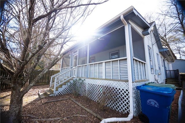 view of side of property with a sunroom