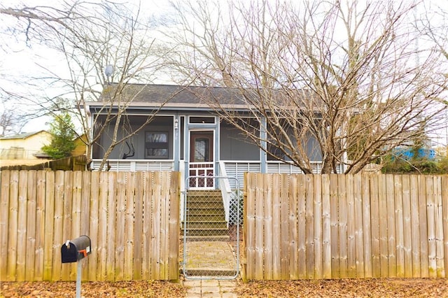 view of front of home with a sunroom