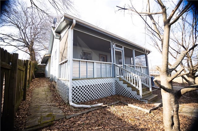 view of front of property featuring a sunroom