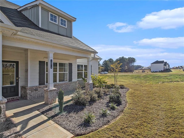 exterior space with a porch and a yard