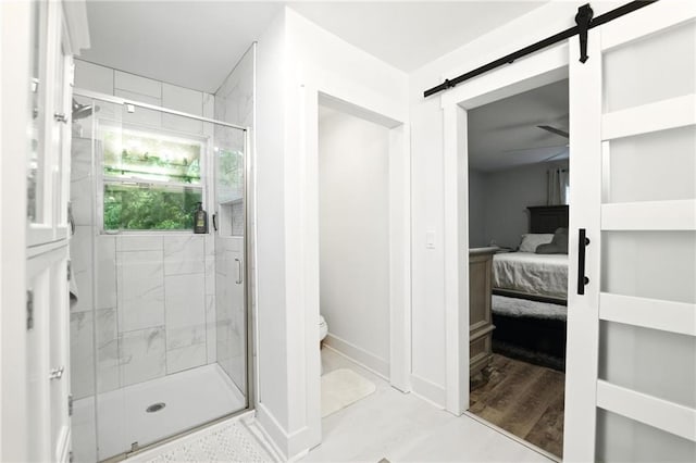 full bath with a stall shower, toilet, ensuite bath, and baseboards