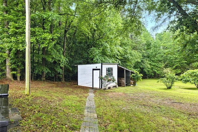 view of shed with a forest view
