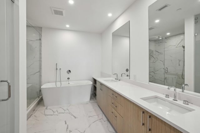 bathroom with separate shower and tub and vanity