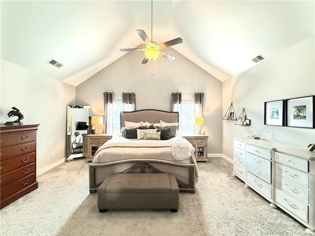 bedroom featuring ceiling fan, vaulted ceiling, and light carpet