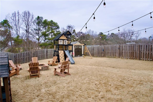 view of playground featuring a fire pit