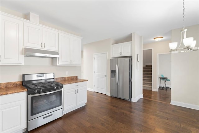 kitchen featuring white cabinetry, pendant lighting, dark wood-type flooring, and appliances with stainless steel finishes