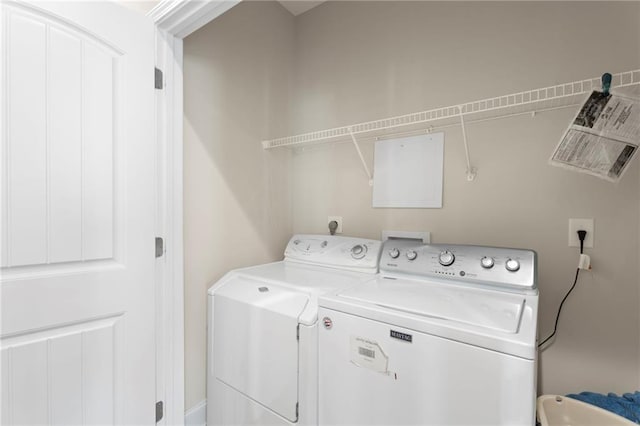 laundry area with separate washer and dryer