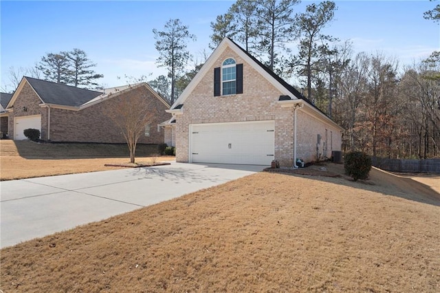 view of home's exterior featuring a garage and a lawn