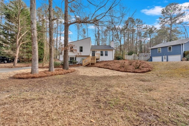 view of front of property with a garage and a front yard