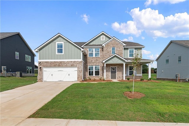 craftsman house with a front yard and a garage