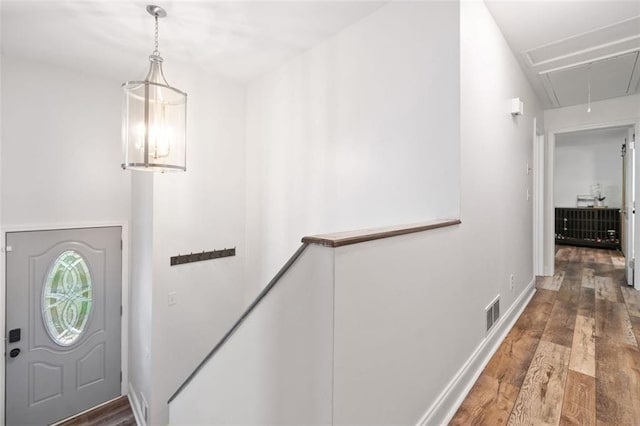 foyer entrance featuring wood finished floors and baseboards