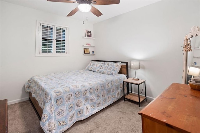 bedroom with carpet floors, baseboards, and a ceiling fan
