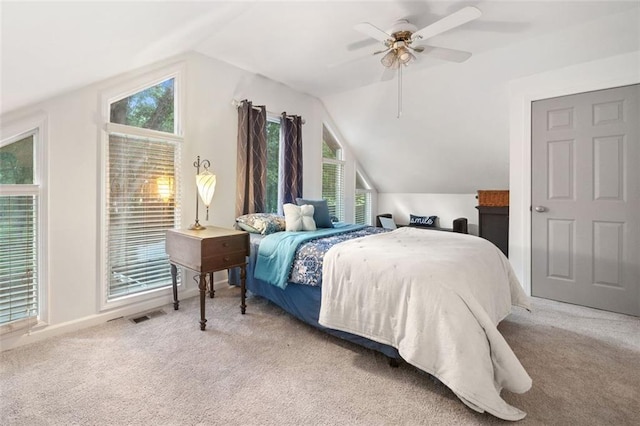 bedroom featuring vaulted ceiling, carpet floors, ceiling fan, and baseboards