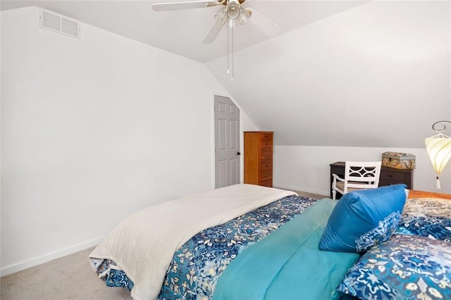 bedroom featuring vaulted ceiling, baseboards, carpet floors, and a ceiling fan