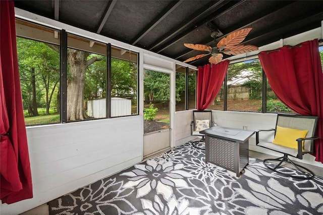 sunroom with a ceiling fan