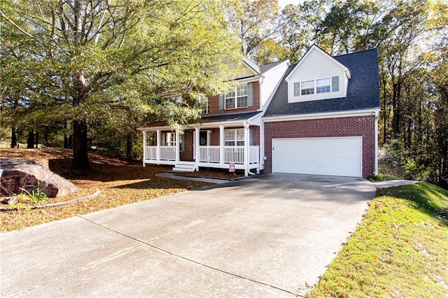 view of front of property with brick siding, a porch, a shingled roof, concrete driveway, and a garage