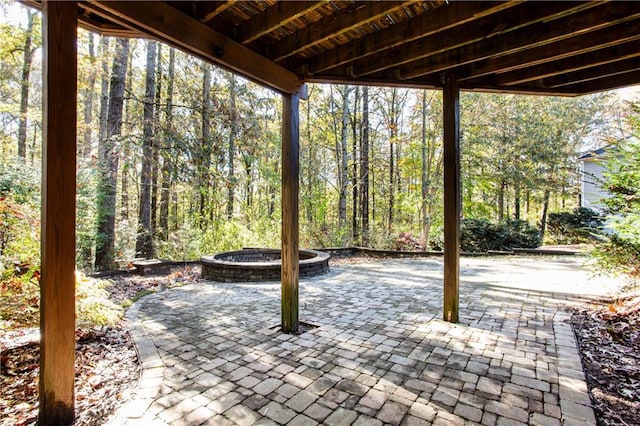 view of patio / terrace featuring a view of trees