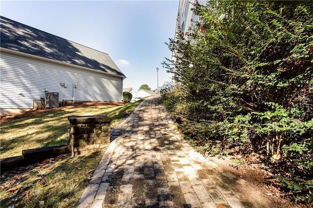 exterior space featuring decorative driveway