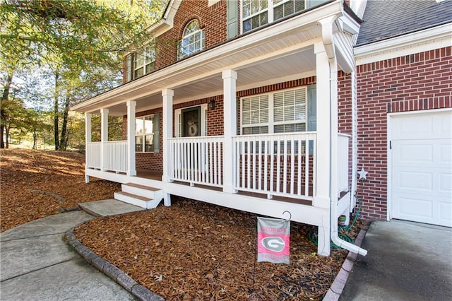 property entrance featuring a porch, brick siding, and a shingled roof