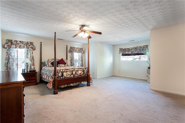 bedroom featuring multiple windows, carpet, and baseboards