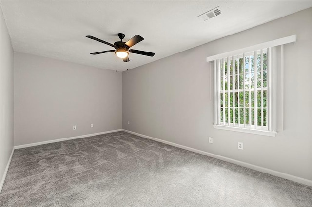 spare room featuring ceiling fan and carpet flooring