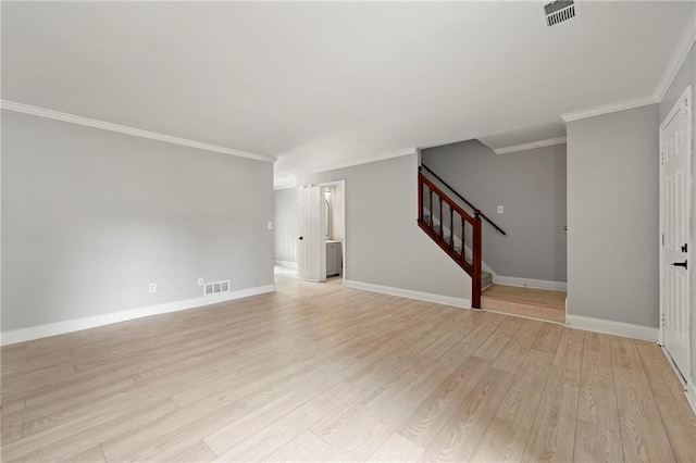 unfurnished living room with light hardwood / wood-style flooring and ornamental molding