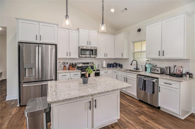 461 Barnwood Dr, Rockmart, GA 30153 - kitchen with appliances with stainless steel finishes, a sink, white cabinets, backsplash, and lofted ceiling