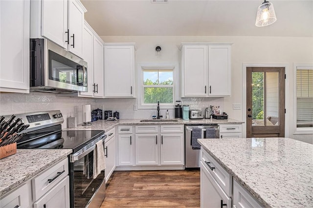 461 Barnwood Dr, Rockmart, GA 30153 - kitchen featuring appliances with stainless steel finishes, a sink, white cabinetry, and decorative backsplash