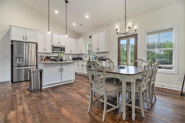461 Barnwood Dr, Rockmart, GA 30153 - dining area featuring a chandelier, dark wood finished floors, baseboards, recessed lighting, and high vaulted ceiling