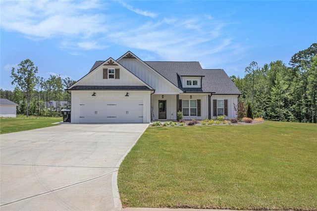 461 Barnwood Dr, Rockmart, GA 30153 - modern farmhouse featuring concrete driveway, an attached garage, a front yard, and board and batten siding