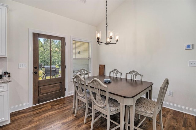 461 Barnwood Dr, Rockmart, GA 30153 - dining area with a chandelier, dark wood finished floors, baseboards, and vaulted ceiling